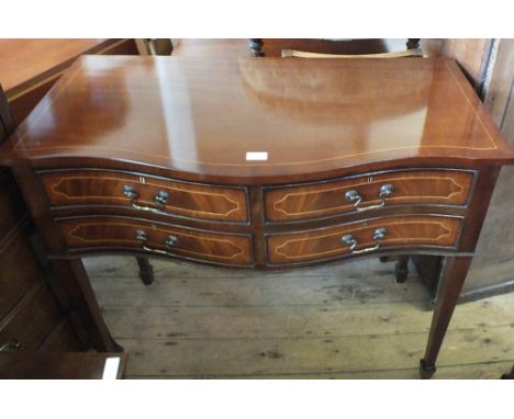 A reproduction inlaid Mahogany bow front hall table with four drawers