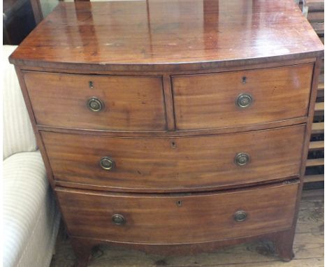 A 19th Century Mahogany bow fronted chest of three drawers on bracket feet