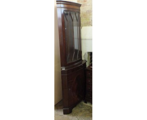 A Mahogany corner cabinet, a reproduction inlaid Mahogany chest of four drawers