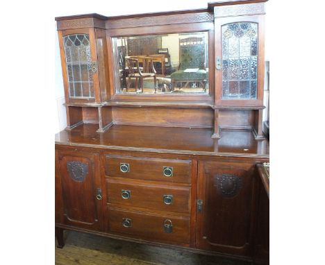 An Edwardian Mahogany lead light and mirror back sideboard