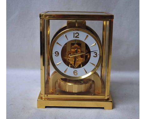 A Jaeger le Coultre Atmos Classic V Mantel Clock, circa 1980, number 432047 in brass pillar case, white chapter ring with Ara