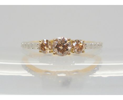 A 9ct gemsTV champagne and white diamond ring, set with estimated approx 0.75cts in total. finger size N1/2, weight 1.7gms Co