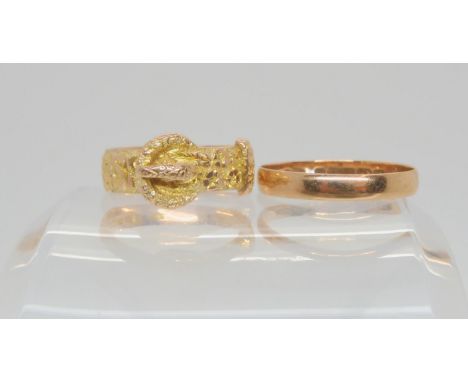 A 9ct gold buckle ring, with Chester Hallmarks for 1910, together with a 9ct rose gold wedding ring, size R1/2, weight togeth