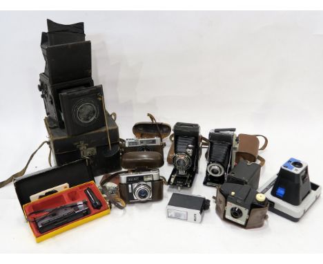 A leather-cased Butcher's Popular Pressman plate camera, together with various vintage cameras and accessories with manufactu