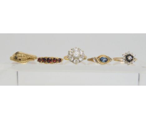 five 9ct gold gem set rings, to include a snake ring with garnet eyes, size P1/2, a five stone garnet ring in scroll mount si