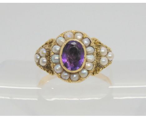 A bright yellow metal Victorian style ring set with amethyst and pearls, size R1/2, weight 4.1gms Condition Report:Available 