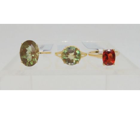 Three Andesine rings, an unusual type of labradorite feldspar. A 9ct gold cushion cut red andesine and zircon ring, size N1/2