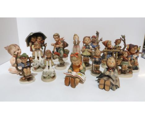 A collection of Hummel figures including Stormy Weather, Goose Girl, She loves me she Loves me not, and other figures Conditi