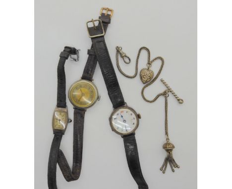 Two silver cased ladies vintage watches and a Nickle cased example, and a white metal fob chain with tassel and heart motif C