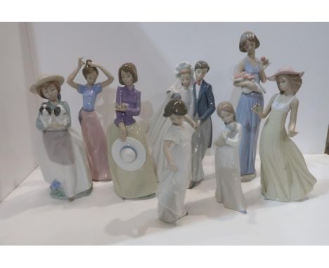 Eight Nao figures including a bride and groom, girl with puppies etc Condition Report:Available upon request