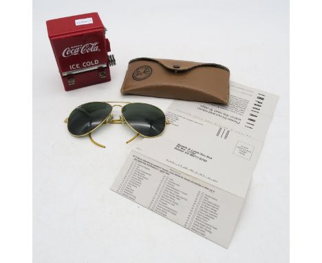 A pair of vintage Ray-Ban aviator sunglasses, contained in their original leatherette case; and a Coca-Cola cocktail stick di