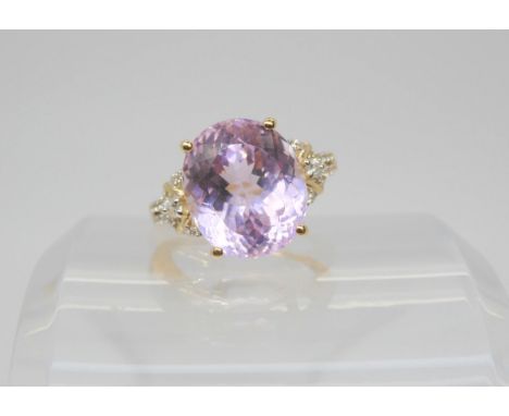 A 9ct gold GemsTV kunzite and zircon ring, designed by Thomas Rae, size O, weight 5.5gms Condition Report:Available upon requ