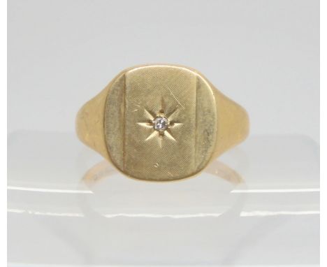 A 9ct signet ring with a star set diamond accent, size T1/2, weight 6gms Condition Report:Available upon request