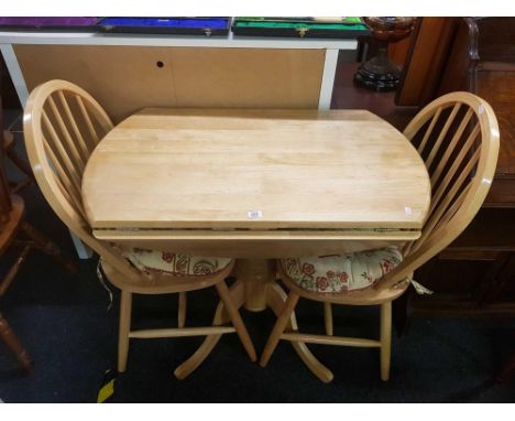 LIGHT COLOURED DROP FLAP KITCHEN TABLE WITH 2 MATCHING SPINDLE BACK CHAIRS