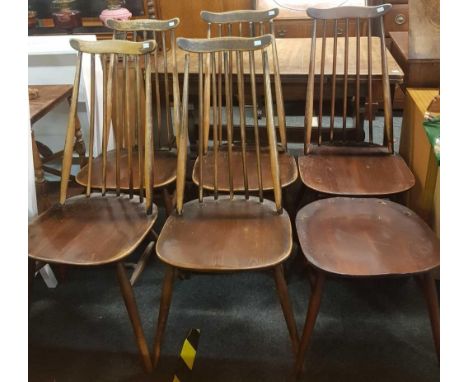 AN ERCOL OLD COLONIAL DRAW LEAF DINNING TABLE WITH 6 MUSTACHE DINING CHAIRS - 1 CHAIR A/F