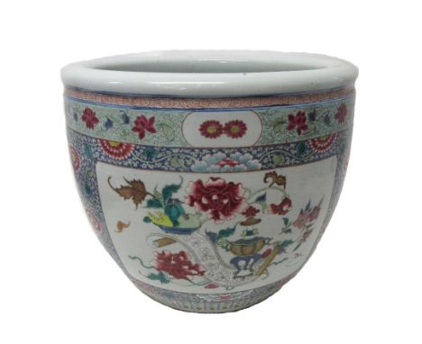 A Chinese famille-rose jardiniere, circa 1900, painted with two large rectangular panels and smaller fan and circular panels 