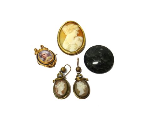 A gold and enamelled brooch, of oval form, with a ribbon tied bow surmount, the central panel enamelled with the portrait of 