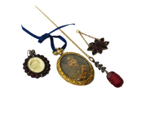 A red paste and seed pearl set pendant, with a gold neckchain, detailed 9 K, a Bohemian garnet set oval pendant locket, a Boh