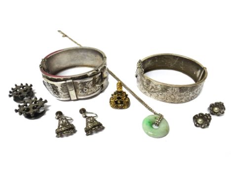 A Victorian bloodstone set pendant fob seal, monogram engraved, a Victorian oval hinged bangle in a buckle and strap design, 