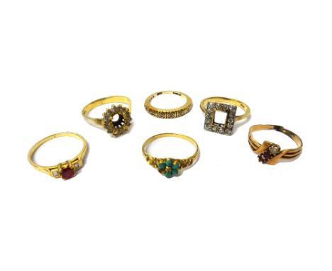 A gold and diamond set rectangular ring (the central gemstone lacking), with a surround of cushion shaped diamonds, detailed 