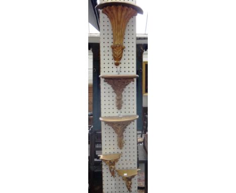 A pair of Florentine giltwood wall brackets (16cm high), a further pair of composite wall brackets and a larger single giltwo