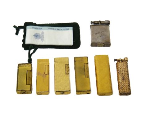 A Dunhill Paris silver-gilt curved rectangular gas lighter, with simulated basket weave decoration, import mark London 1974, 