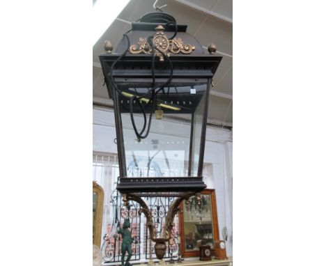 A Victorian style gilt and patinated metal hall lantern, modern, with pierced domed top and square section tapering body, enc