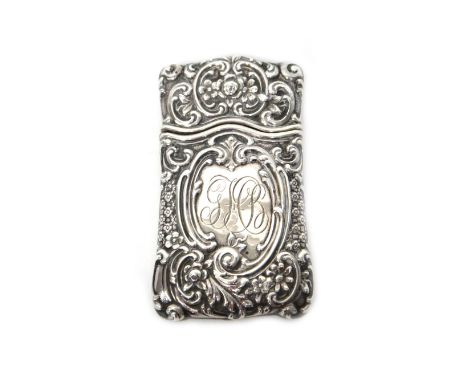A Tiffany & Co Sterling silver shaped rectangular vesta case, with floral, foliate and scroll embossed decoration, monogram e