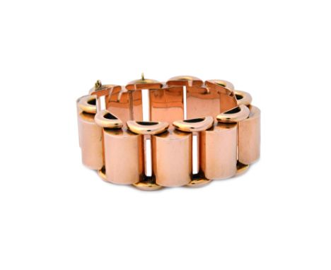 A gold bracelet, in a wide tubular and 'D' section link design, on a snap clasp, detailed 18 K, circa 1940s, length 19cm, wei
