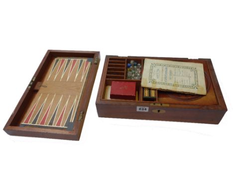 A mahogany cased games compendium by Asser & Sherwin, early 20th century, containing; solitaire, backgammon, chess, race and 