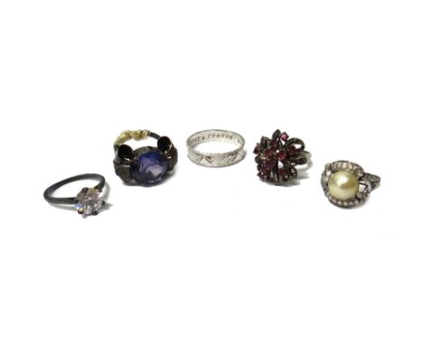 An Oriental wedding band ring, with waved decoration, presentation inscribed within, weight 6.2 gms and four further gem set 