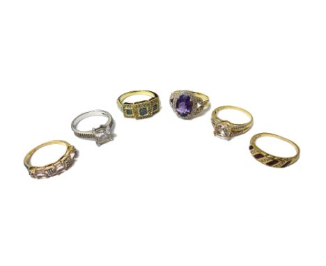 A 9ct gold, diamond and treated blue diamond set ring, in a triple square cluster design, a 9ct gold oval cut amethyst and di