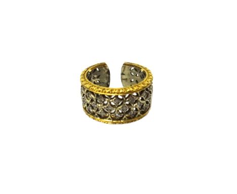 A two colour gold and diamond set ring, in a lattice work pierced openwork design, mounted with circular cut diamonds, ring s