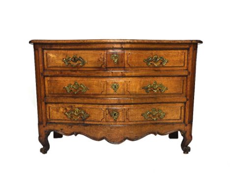 An 18th century French walnut serpentine three drawer commode, on scroll feet, 133cm wide x 89cm high.  Illustrated
