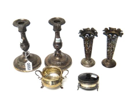 Silver and silver mounted wares, comprising; a pair of George IV table candlesticks, each decorated with floral and foliate b