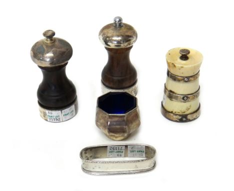 A silver mounted ivory peppermill, Birmingham 1906, two silver mounted wooden peppermills, London 1986 and 1987, a napkin rin