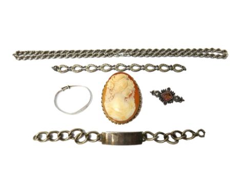 A 9ct gold mounted oval shell cameo pendant brooch, carved as the portrait of a lady, a silver bracelet, formed as a row of h