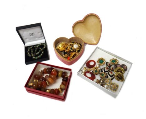 A collection of costume jewellery, including; a tiger's eye bead necklace carved as Oriental masks, a vary coloured freshwate