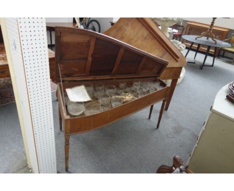 A 19th century glass harmonica/ungaelic organ, on turned supports, 146cm wide x 76cm high.