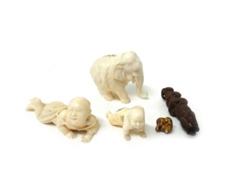 A Japanese wood netsuke of the Sambiki Saru, late 19th/early 20th century; an ivory ojime of a monkey; two carvings of crawli