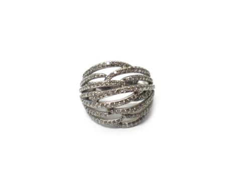 A white gold and diamond set dress ring, in a pierced openwork multiple row design, set with circular cut diamonds, detailed 