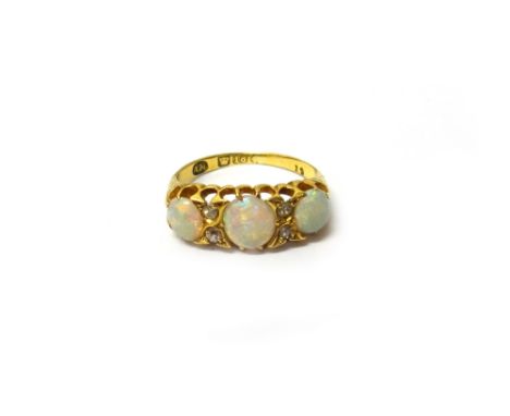 An 18ct gold, opal and diamond ring, mounted with three oval opals alternating with two pairs of cushion shaped diamonds, rin