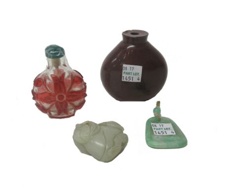 A Chinese jade carving of a bat on a peach, 19th century, of pale celadon tone, 4.5cm; together with a red overlay glass snuf