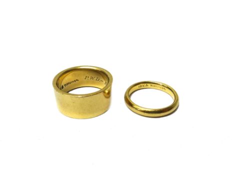 A Tiffany & Co wide band wedding ring, detailed 14 KT, Tiffany & Co and engraved with initials, ring size J, weight 8.2 gms a
