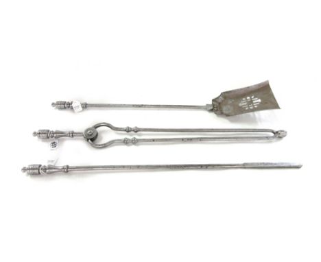A set of Victorian steel fire tools, with ribbed handles, the pierced shovel 68cm, together with a Victorian pierced brass pi