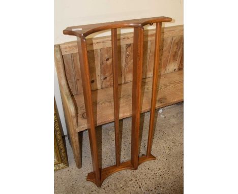 An Ercol two tier wall shelf
