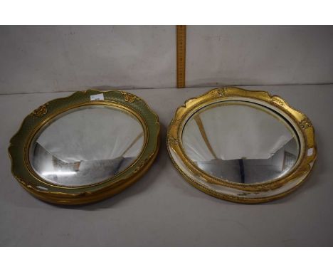 Two convex porthole style mirrors in gilt finish frames