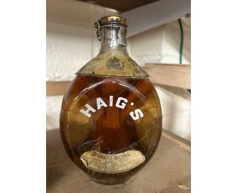 A bottle of vintage Haigs Dimple Scotch Whisky