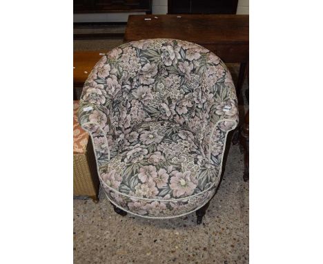 A late Victorian button back armchair with floral upholstery