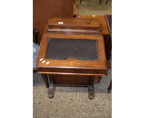 A late Victorian walnut and inlaid Davenport desk